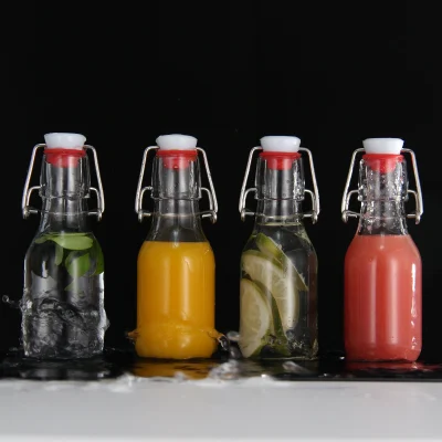 Clear Round 4 oz Small Glass Flip Top Bottles for Vinegar Beverage