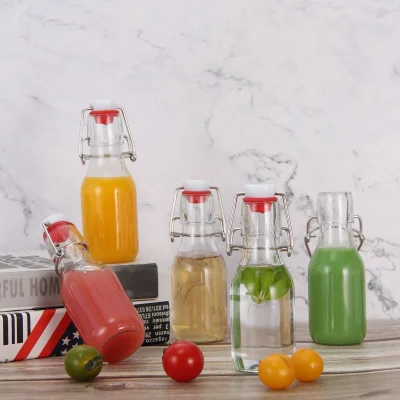 Clear Round 4 oz Small Glass Flip Top Bottles for Vinegar Beverage